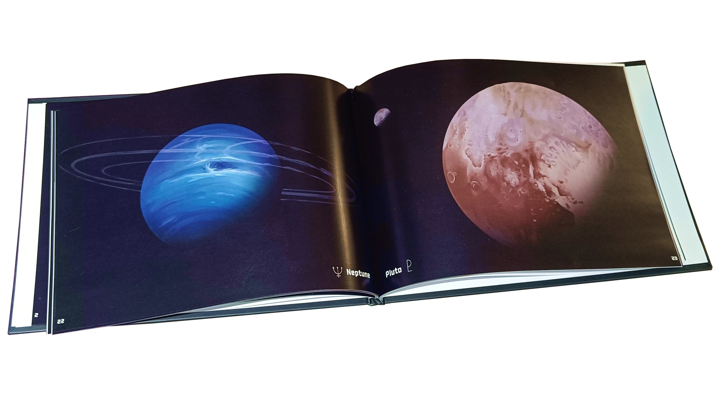 Open Beyond Us art book showing illustrations of Neptune and Pluto